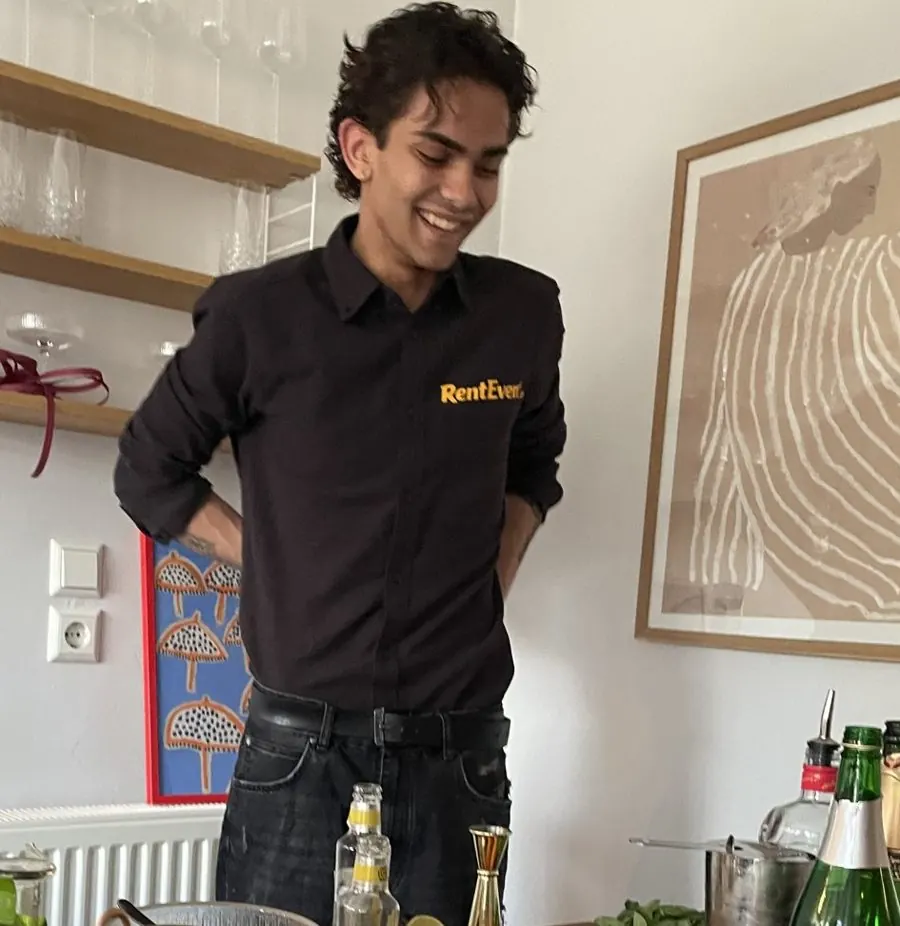 Smiling RentEvent bartender at the bar