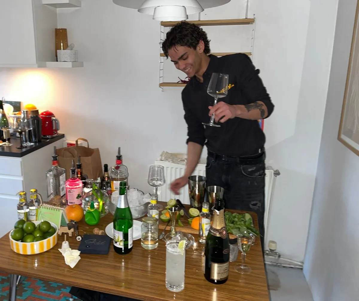 RentEvent bartender at a cocktail bar at a home party