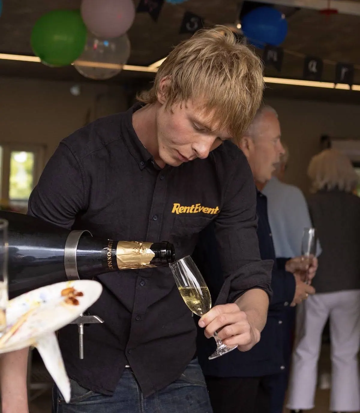 RentEvent bartender pouring a drink at a party