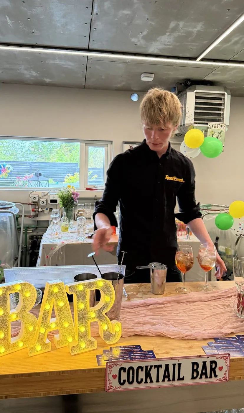 RentEvent bartender mixing cocktails at a cocktail bar at a party at home