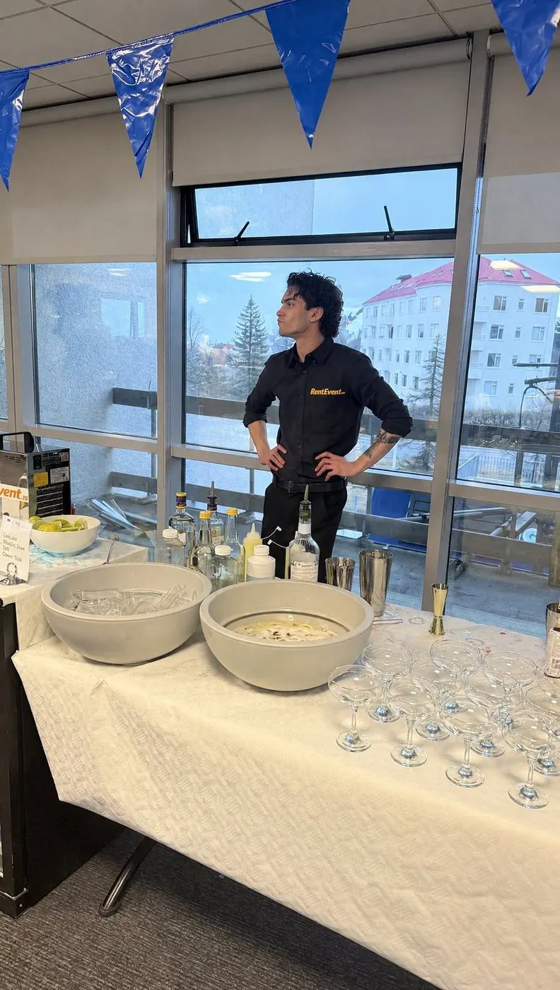 RentEvent bartender at a fully set-up bar at a staff event in an office