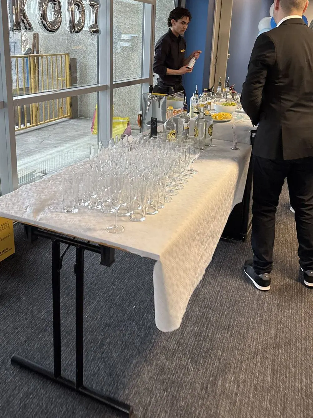 Glasses ready on a bar counter for a party