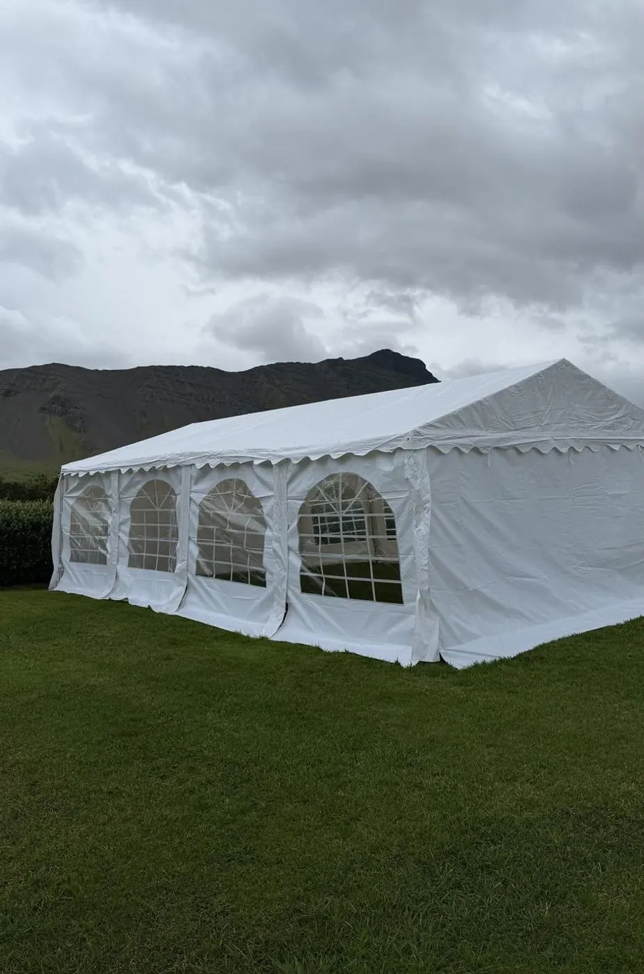 RentEvent party tent put up on a lawn for a graduation party